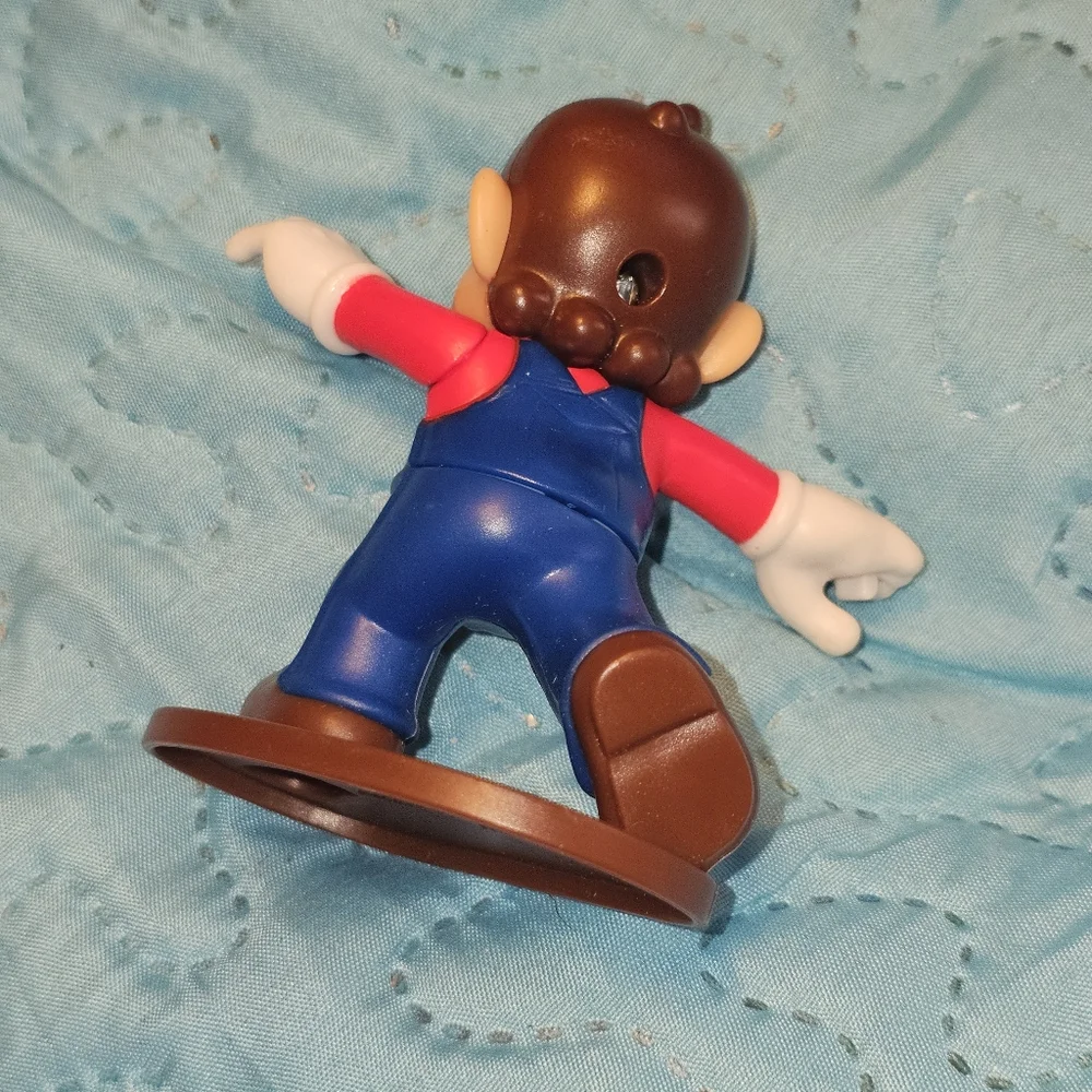 McDonald's Happy Meal toy featuring Mario from the Super Mario Bros. franchise.‎